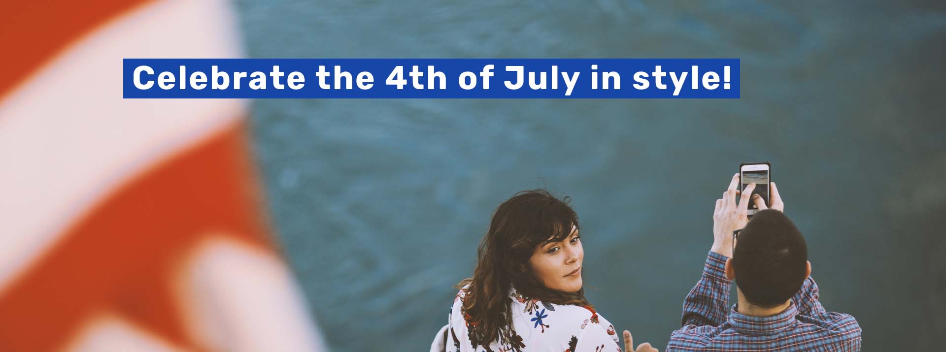 2021_Q2-Q4_FLT_Independence-Day_Web_Slider_Flag_01 woman and man on boat with american flag in foreground