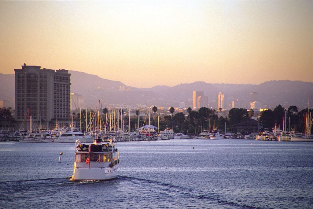 A yacht cruising in Marina del Rey Harbor.