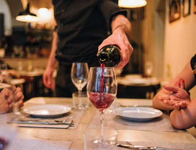 pouring wine in glasses