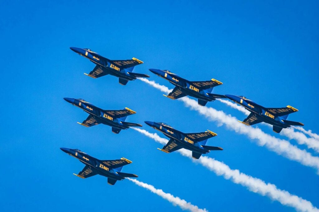 Blue Angeles US Navy Jets flying in formation.