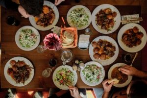 Looking down at food on table.