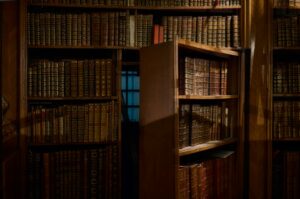 Hidden room behind a bookcase.