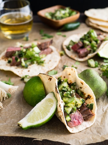 Tacos laid out on brown paper