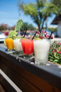 Cocktails outside on a railing