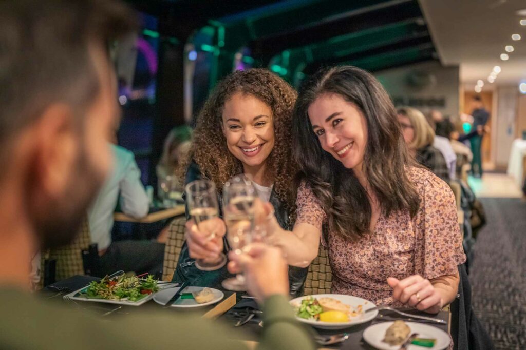 women toasting on city cruises uk