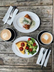 Breakfast plated on a wood table