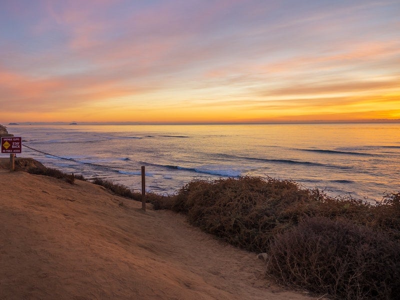 Cliffs above the ocean at sunset