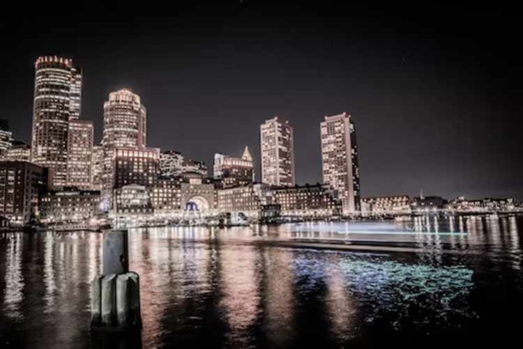 skyline of boston harbor at night