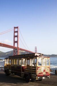 Trolley car Bus with Golden Gate Bridge in background