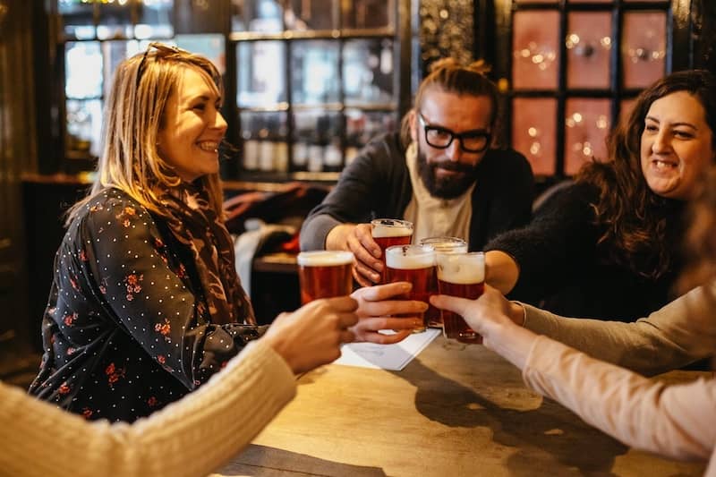 London pub beers being cheered