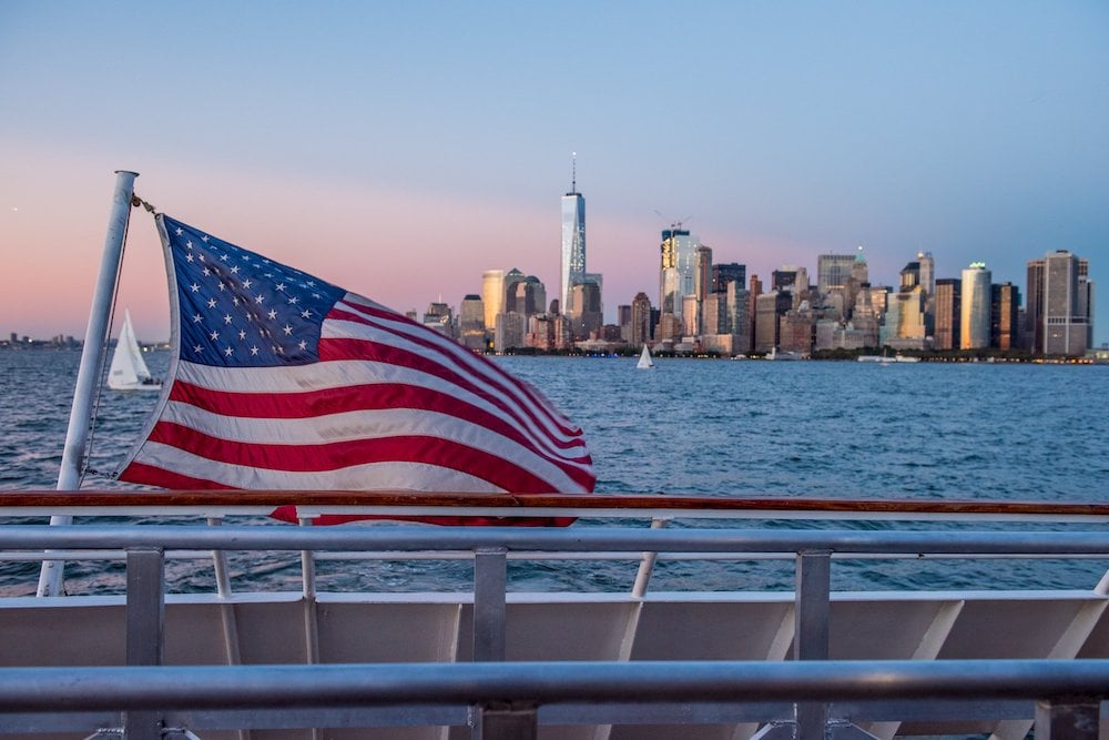 American Flag with New York City skyline in background