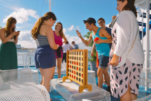 People playing large format Connect Four game