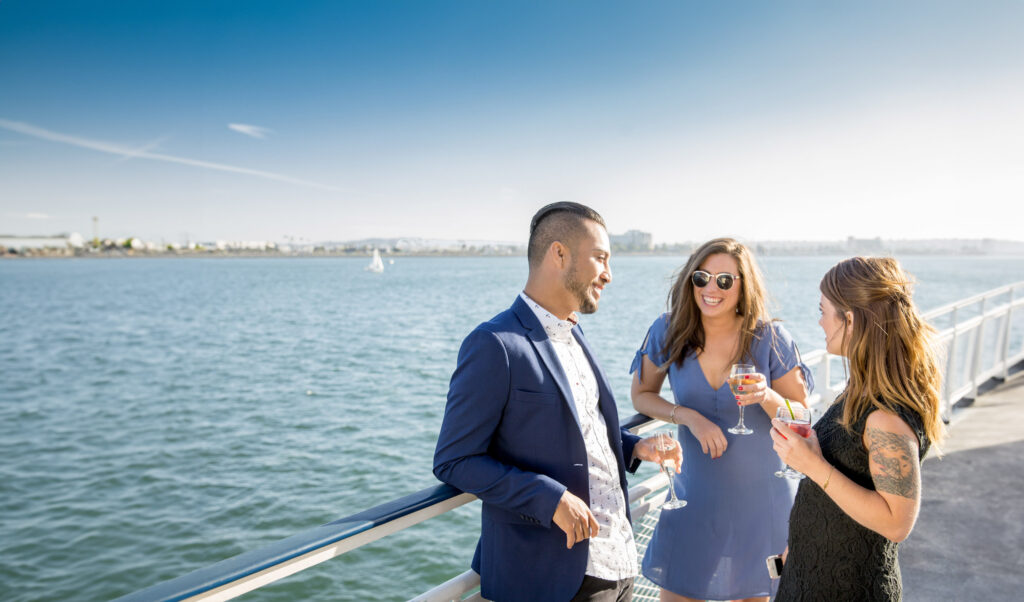 people on a boat having a cocktail in long beach on water