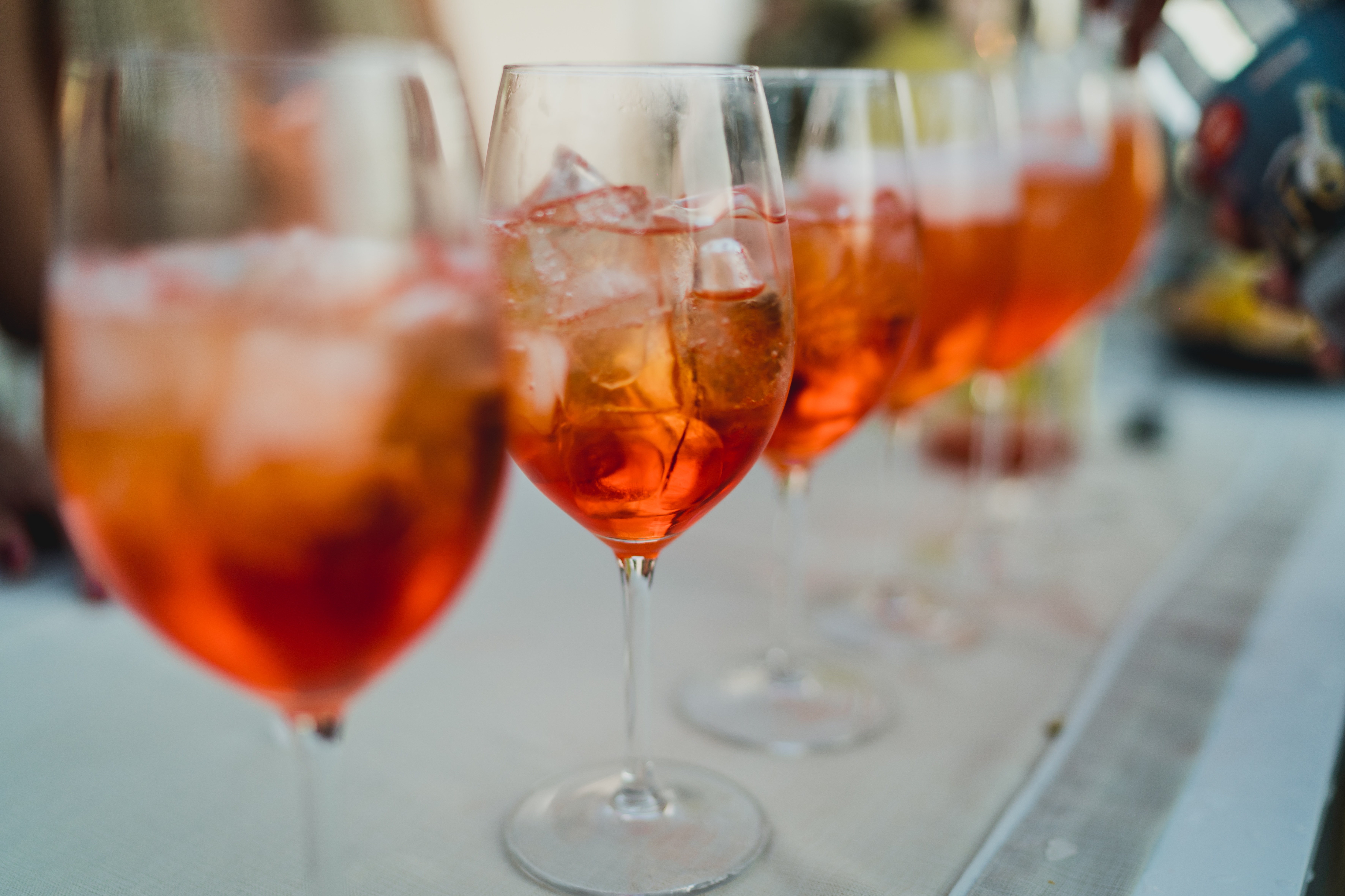 line of aperol spritz drinks