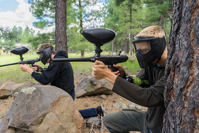 group playing paintball