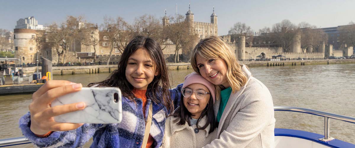 family taking selfie in london