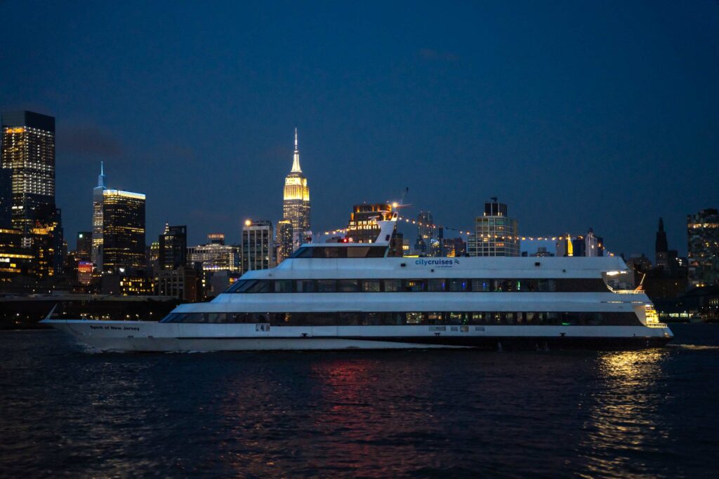 Spirit of New Jersey boat on the East River at night