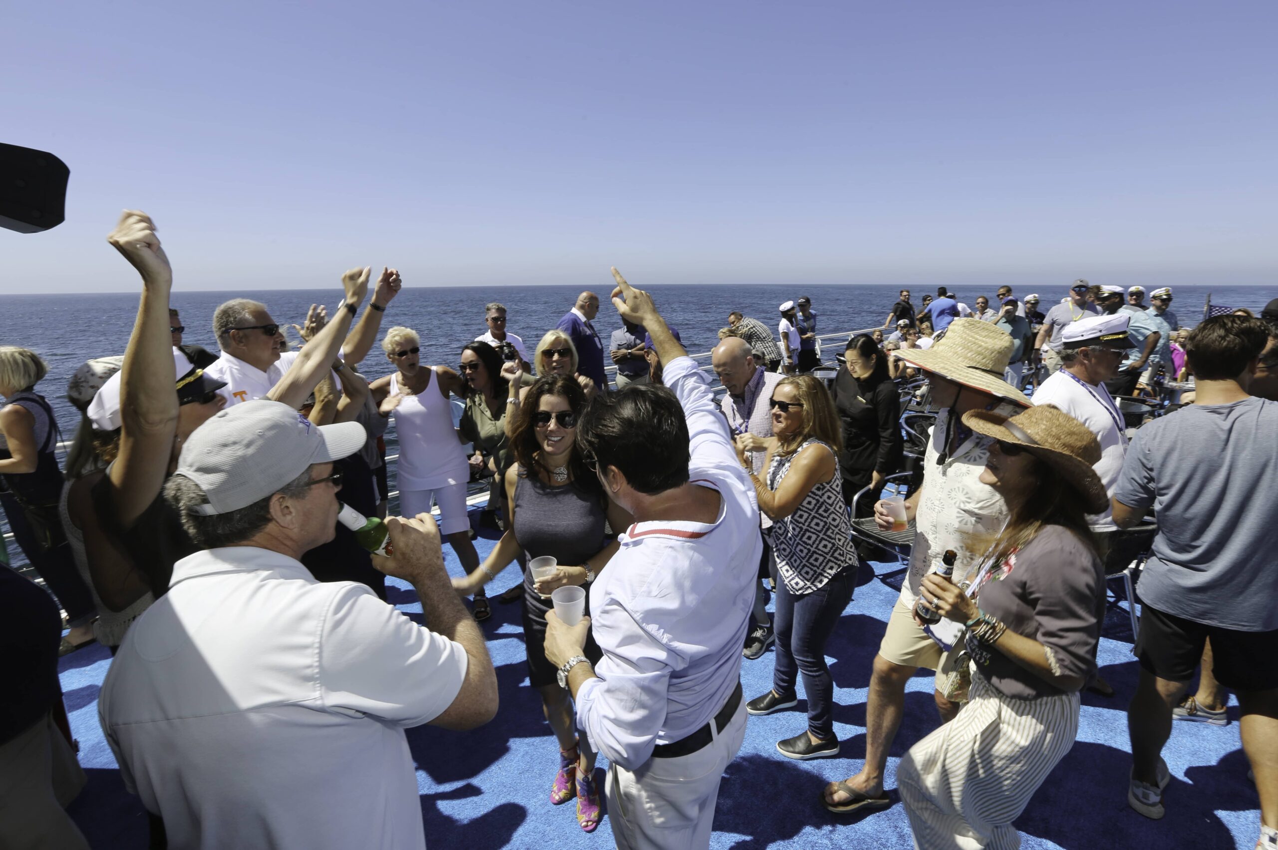 group on deck of boat with drinks