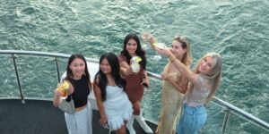 group of women toasting on boat