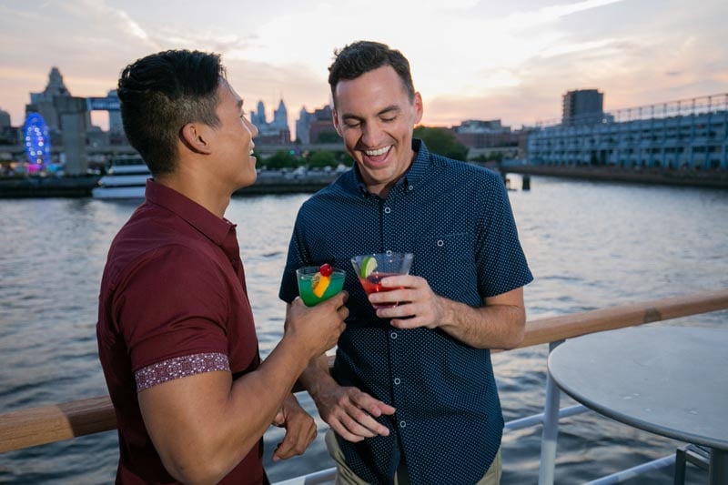 2 men toasting in philadelphia on boat
