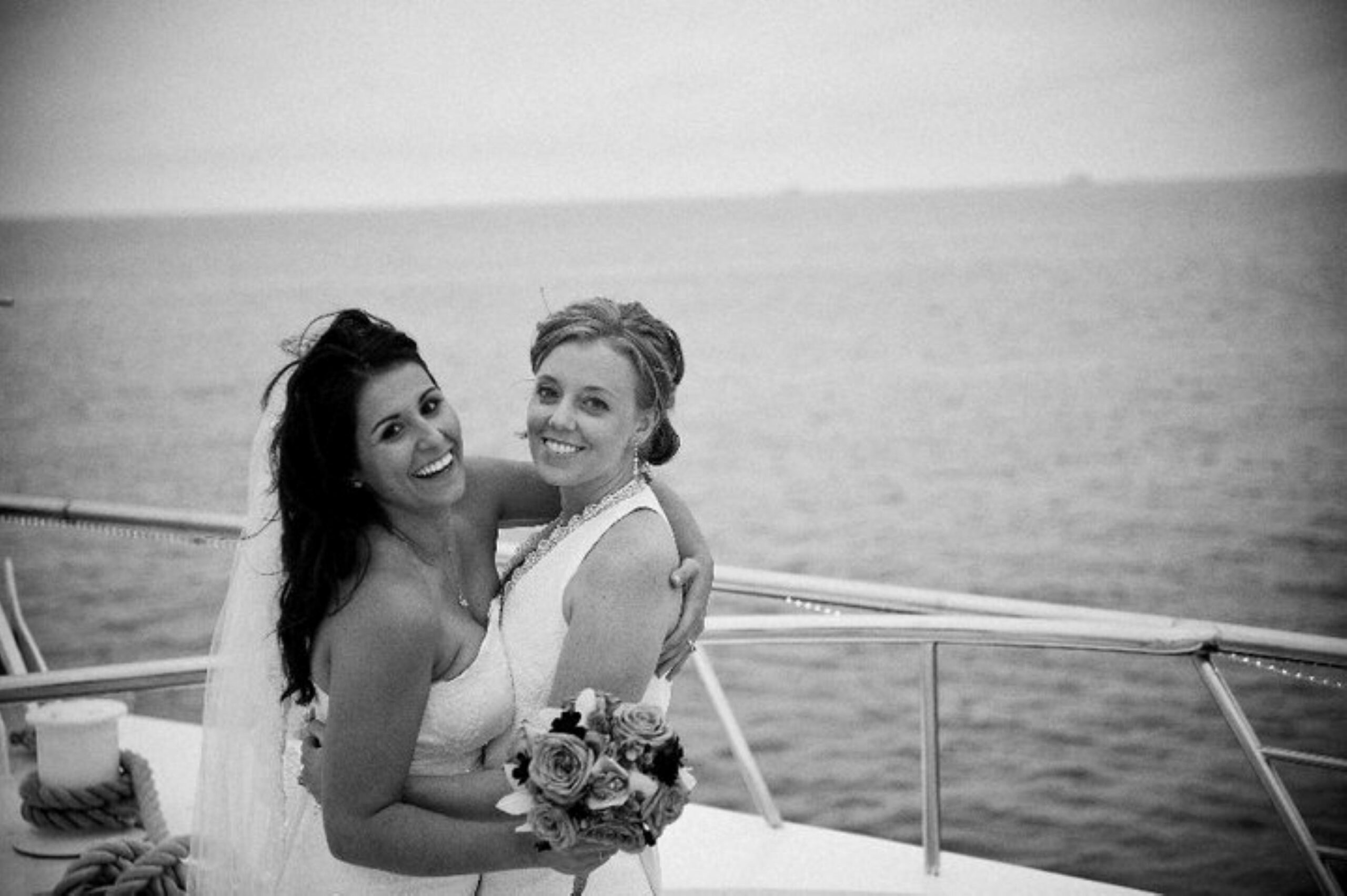 crew member amber cross and wife hugging on endless dreams wedding
