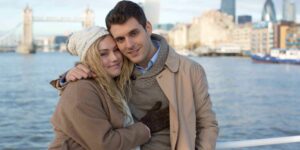 london couple on boat with city skyline