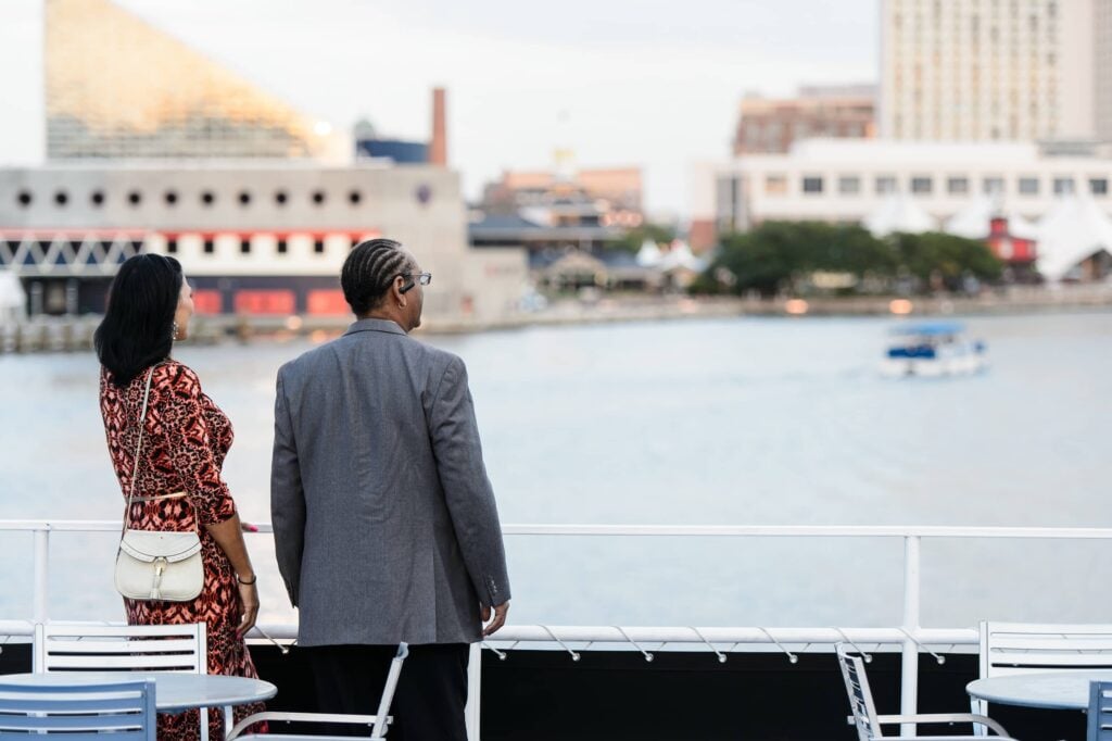 Couple in Baltimore on City Cruises yacht overlooking the Patapsco River