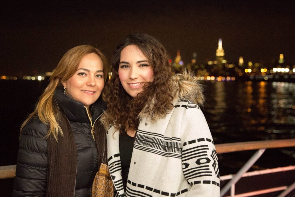 Guest enjoying dinner on a City Cruises dining cruise in NYC