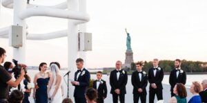 Wedding on City Cruises with the Statue of Liberty in the background