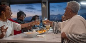 Group toasting at a retirement party on City Cruises vessel