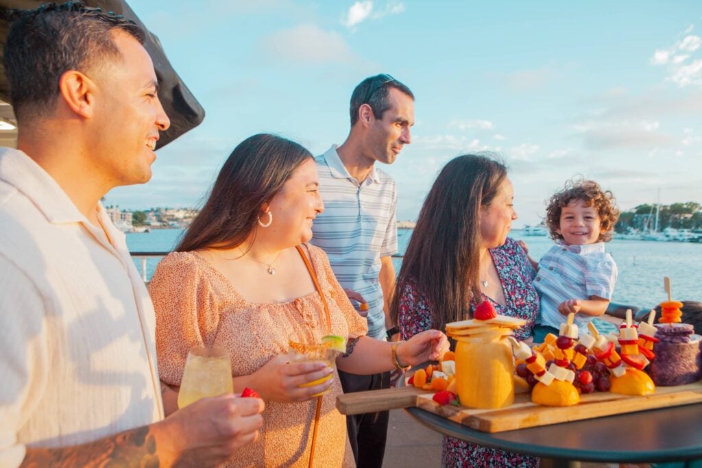 Group enjoying eating on the Los Angeles waterfront on City Cruises vessel