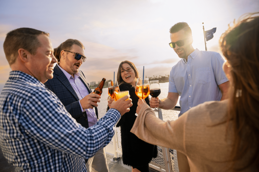 Group toasting onboard City Cruises in San Diego