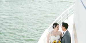 bride and groom on deck in california