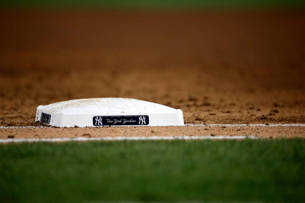 Base on baseball diamond that has New York Yankees logo
